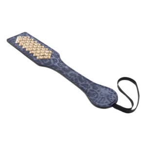 leopard print paddle with gold spikes facing away