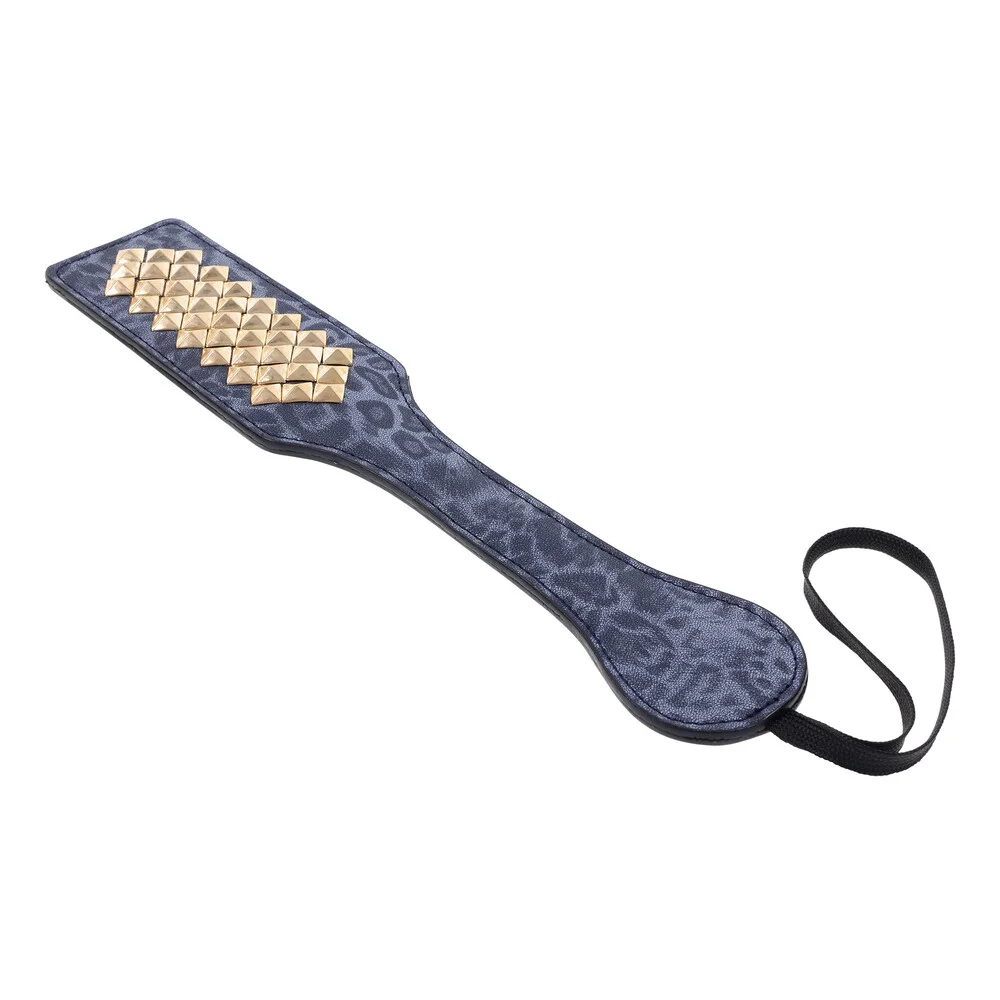 leopard print paddle with gold spikes facing away